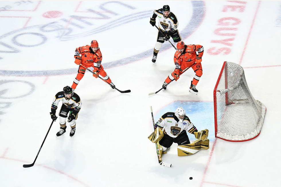 Sheffield Steelers game action viewed across the branded ice
